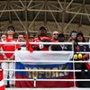 Fans stand during a one minute silence to show respect for the missing Malaysia Airlines flight MH370 before the start of the Malaysian F1 Grand Prix at Sepang International Circuit outside Kuala Lump