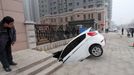 Road Cave-in In Weifang WEIFANG, CHINA - FEBRUARY 28: (CHINA OUT) A car is trapped in a huge hole after a cave-in happened at a gate of a residential community on February 28, 2013 in Weifang, Shandong Province of China. The cave-in occurred on Wednesday afternoon, engulfing a parked car. No casualties were reported.