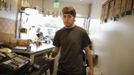 Steffen Andrews, a 24 year-old waiter, serves a customer at Sunny Blue restaurant in Santa Monica, California April 24, 2012. Andrews studied for four and a half years at Cabrillo College where he received a degree in communications. He came to Los Angeles to work in the film industry but is now unsure what career he wants to pursue.