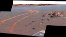 D-Star Panorama by Opportunity (False Color) NASA's twin Mars Exploration Rovers have been getting smarter as they get older. This view from Opportunity shows the tracks left by a drive executed with more onboard autonomy than has been used on any other drive by a Mars rover. Opportunity made the curving, 15.8-meter (52-foot) drive during its 1,160th Martian day, or sol (April 29, 2007). It was testing a navigational capability called "Field D-star," which enables the rover to plan optimal long-range drives around any obstacles in order to travel the most direct safe route to the drive's designated destination. Opportunity and its twin, Spirit, did not have this capability until the third year after their January 2004 landings on Mars. Earlier, they could recognize hazards when they approached them closely, then back away and try another angle, but could not always find a safe route away from hazards. Field D-Star and several other upgrades were part of new onboard software uploaded from Earth in 2006. The Sol 1,160 drive by Opportunity was a Martian field test of Field D-Star and also used several other features of autonomy, including visual odometry to track the rover's actual position after each segment of the drive, avoidance of designated keep-out zones, and combining information from two sets of stereo images to consider a wide swath of terrain in analyzing the route. Two days later, on Sol 1,162, (May 1, 2007), Opportunity was still at the location it reached during that drive, and the rover's panoramic camera (Pancam) took the exposures combined into this image. Victoria Crater is in the background, at the top of the image. The Sol 1,160 drive began at the place near the center of the image where tracks overlap each other. Tracks farther away were left by earlier drives nearer to the northern rim of the crater. For scale, the distance between the parallel tracks left by the rover's wheels is about 1 meter (39 inches) from the middle of one track to the middle of the other. The rocks in the center foreground are roughly 7 to 10 centimeters (3 to 4 inches) tall. The rover could actually drive over them easily, but for this test, Settings in the onboard hazard-detection software were adjusted to make these smaller rocks be considered dangerous to the rover. The patch of larger rocks to the right was set as a keep-out zone. The location from which this image was taken is where the rover stopped driving to communicate with Earth. A straight line from the starting point to the destination would be 11 meters (36 feet). Opportunity plotted and followed a smoothly curved, efficient path around the rocks, always keeping the rover in safe areas. This view combines separate images taken through the Pancam filters centered on wavelengths of 753 nanometers, 535 nanometers and 432 nanometers. It is presented in a false-color stretch to bring out subtle color differences in the scene. Image credit: NASA/JPL-Caltech/Cornell University