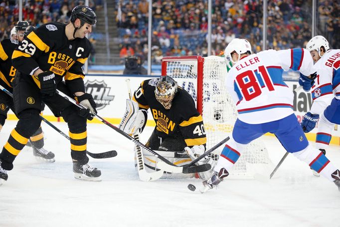 Boston Bruins goalie Tuukka Rask (40) and Boston Bruins defenseman Zdeno Chara (33) block a shot by Montreal Canadiens center Lars Eller (81)