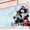 Germany's goaltender Endras and Kohl are challenged by Canada's Hall during their Ice Hockey World Championship game at the O2 arena in Prague