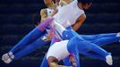 South Korea's Kim Soo-myun rotates above the horizontal bar during men's gymnastics podium training before the 2012 London Olympic Games in London July 25, 2012. Picture taken with multiple exposures. REUTERS/Mike Blake (BRITAIN - Tags: SPORT OLYMPICS GYMNASTICS) Published: Čec. 25, 2012, 4:38 odp.