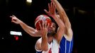 Serbia's Milos Teodosic (L) goes up for a basket over Czech ME, Česk's Petr Benda during their EuroBasket 2015 quarter-final game at the Pierre Mauroy stadium in Villeneu