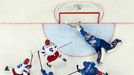 Russia's Sergei Plotinikov (L) scores past Kazakhstan's goalie Alexei Ivanov (R) after a pass by team mate Alexander Ovechkin (8) during the first period of their men's i