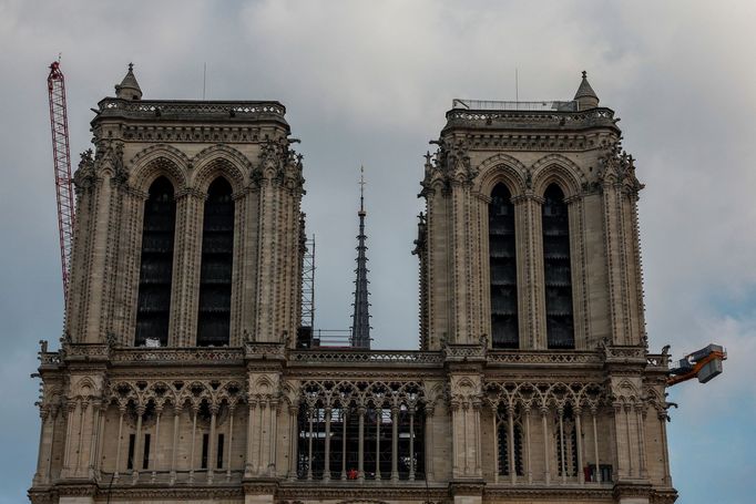 The spire, surmounted by the rooster and the cross, of the Notre-Dame de Paris Cathedral, which was ravaged by a fire in 2019, is pictured as restoration works continue i