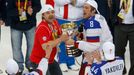 Russia's head coach Oleg Znarok (L) and Alexander Ovechkin celebrate with the trophy after winning their men's ice hockey World Championship final game against Finland at