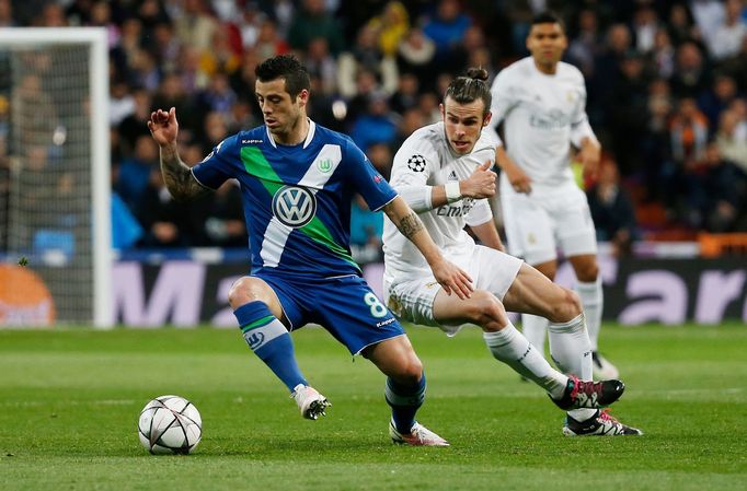 Real Madrid's Gareth Bale in action with Wolfsburg's Vieirinha