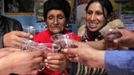 Gladys Tejeda (R), the first Peruvian athlete who qualified for the 2012 London Olympic Games, and her mother Marcelina Pucuhuaranga give a toast at their home in the Andean province of Junin May 13, 2012. A private company will take Pucuhuaranga, 69, to London as part of the "Thank you Mom" program. For Pucuhuaranga, who received her first passport, it will be the first time travelling out of Peru. The program will take about 120 mothers of different athletes around the world to attend the games. Tejeda, the youngest of nine children, returned to her hometown to visit her mother and to focus on training where she will run more than 20 km every day in the highlands (over 4,105 meters above sea level). Picture taken May 13, 2012. REUTERS/Pilar Olivares (PERU - Tags: SPORT ATHLETICS OLYMPICS) Published: Kvě. 17, 2012, 5:09 odp.