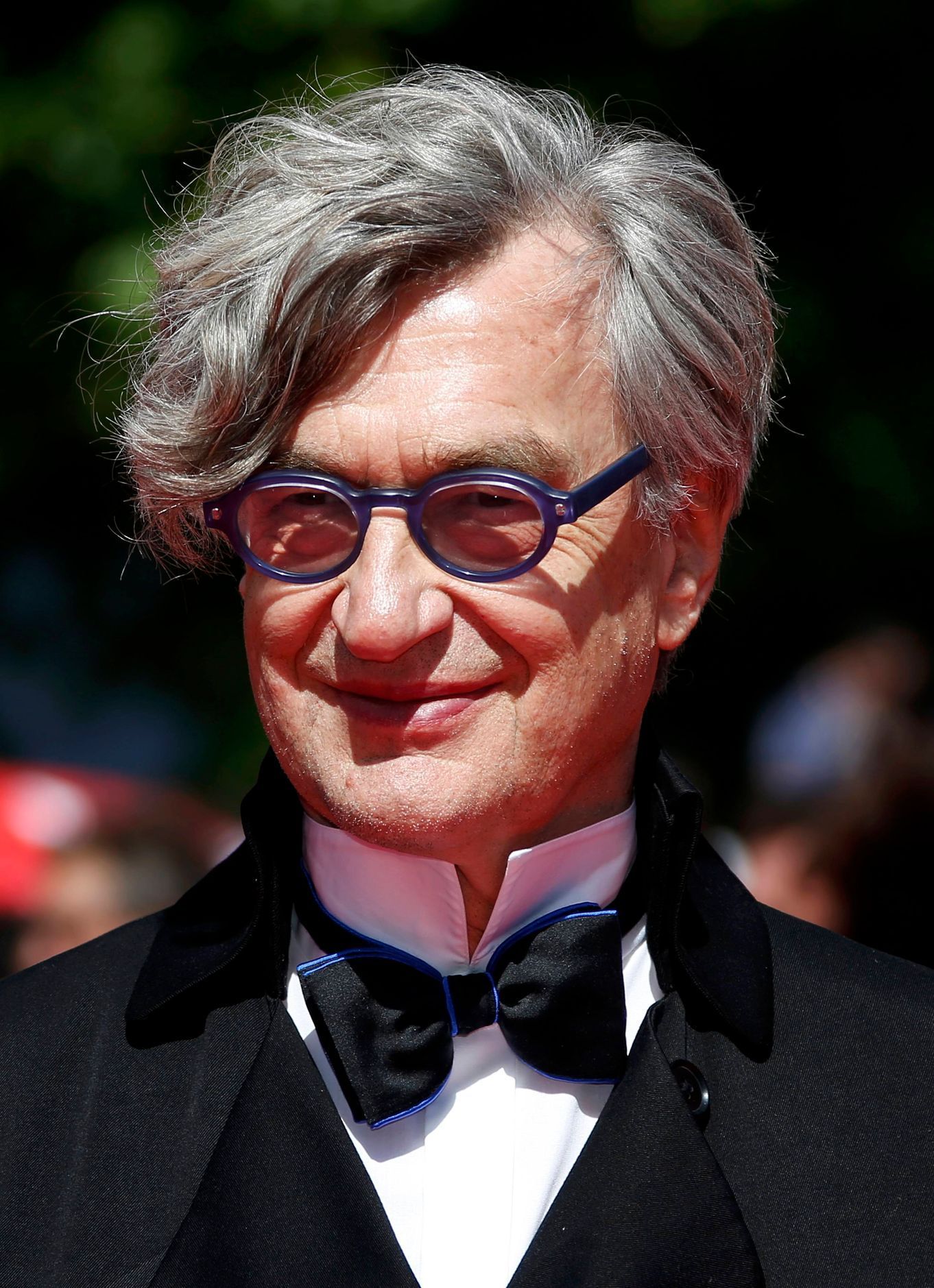 Director Wim Wenders poses on the red carpet as they arrive for the screening of the film &quot;Futatsume no mado&quot; in competition at the 67th Cannes Film Festival
