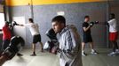 Unemployed Belgian Mohamed Sammar takes part in a "Fit for a job" boxing class in Brussels June 14, 2013. Sammar, 27, has been looking for a job in the construction sector for 2 years. "Fit for a job" is the initiative of former Belgian boxing champion Bea Diallo, whose goal was to restore the confidence of unemployed people and help them find a job through their participation in sports. Picture taken June 14, 2013. REUTERS/Francois Lenoir (BELGIUM - Tags: SPORT BOXING SOCIETY BUSINESS EMPLOYMENT) Published: Čec. 5, 2013, 4:38 odp.