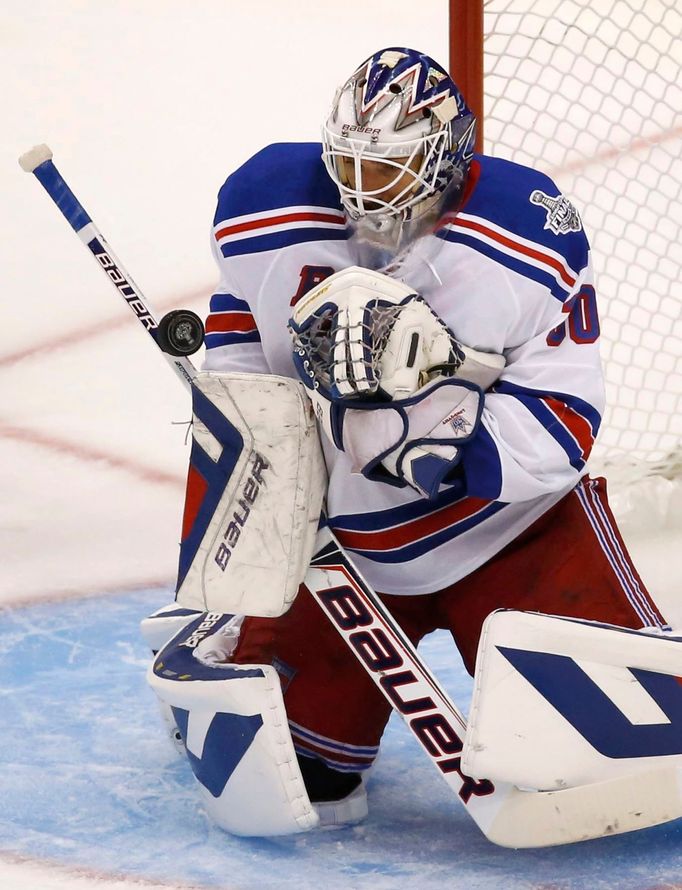 New York Rangers goalie Henrik Lundqvist makes a save against the Los Angeles Kings during the second period in Game 1 of their NHL Stanley Cup Finals hockey series in Lo