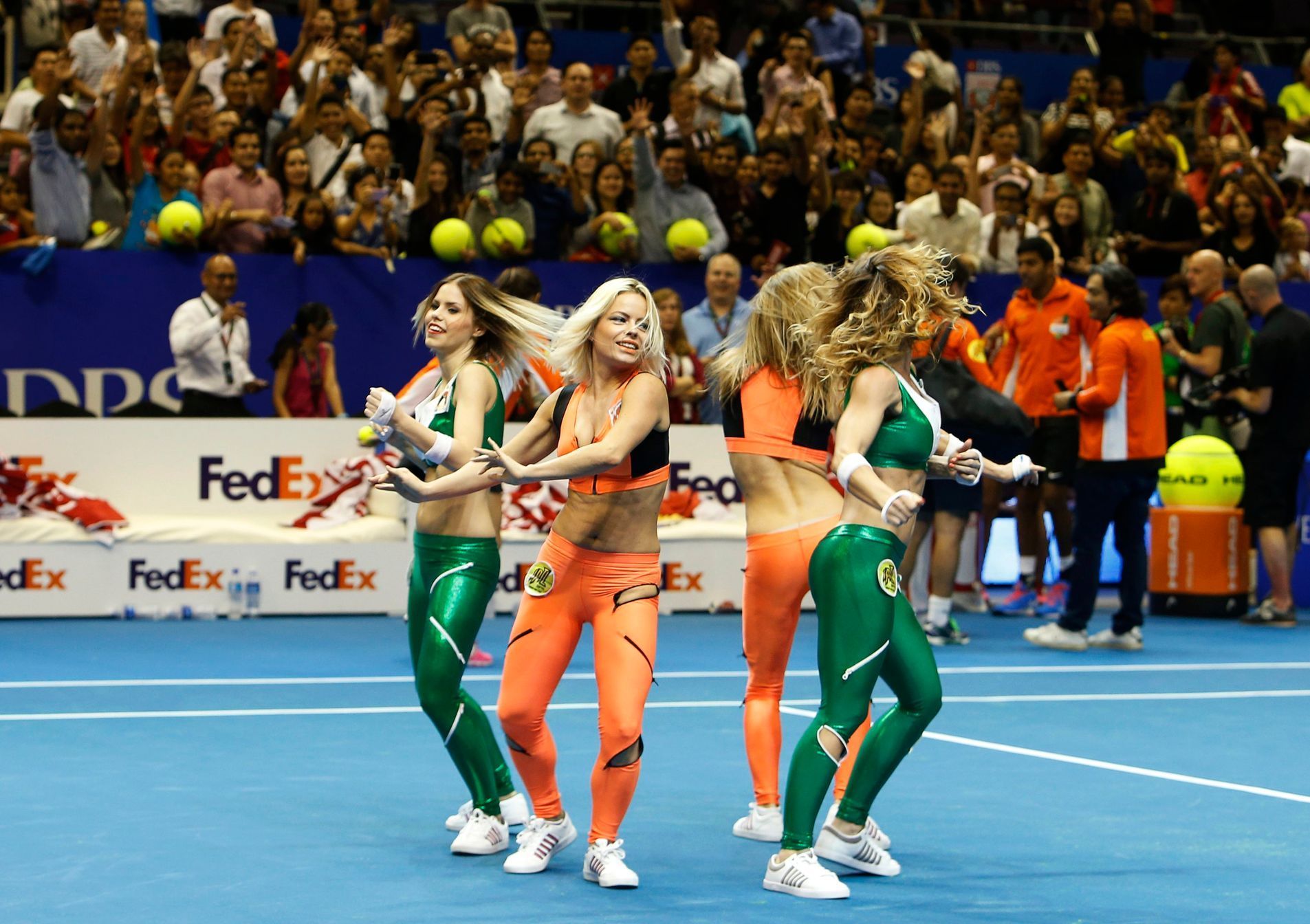 Dancers entertain the crowd after matches between Micromax Indian Aces and UAE Royals at the International Premier Tennis League (IPTL) in Singapore