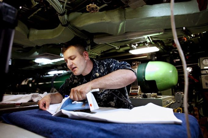 April 25, 2011 - Fort Lauderdale, Florida, U.S. - -- Fort Lauderdale, Fla. -- Don Mikolajczak, Machinist's Mate Chief Senior, irons his dress whites in the the USS Annapolis (SSN 760), a S6G nuclear reactor powered fast attack submarine, sailing from Cape Canaveral on Sunday. The USS Annapolis measures 362 ft. in length and 33 ft. at the beam, a diving depth of over 400 ft., 27+ mph, 12 vertical launch missile tubes, 4 torpedo tubes, and a crew of 130 enlisted submariners. The submarine was commissioned April 11, 1992 with its homeport in Groton, Connecticut. USS Annapolis sailed to the 21st Anniversary of Fleet Week at Port Everglades, Fort Lauderdale. (Credit Image: © Gary Coronado/The Palm Beach Post)