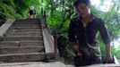 HUAYIN, CHINA - AUGUST 13: (CHINA OUT) Legless man Chen Zhou climbs the Huashan Mountain on August 13, 2012 in Huayin, Shaanxi Province of China. Legless 29-year-old man Chen Zhou from Cangshan of Shandong Province spent two days, 19 hours in total, climbing by arms to the top of Huashan Mountain. Chen lost his legs after falling off a train at the age of 13, but he has since strived to be stronger and joined in many public performances to encourage other people. Chen Zhou will climb the Taishan Mountain in Shandong province in the following months. ( automatický překlad do češtiny )