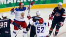 Russia's Nikolai Kulyomin (top, L) celebrates his goal against the U.S. during the first period of their men's ice hockey World Championship group B game at Minsk Arena i