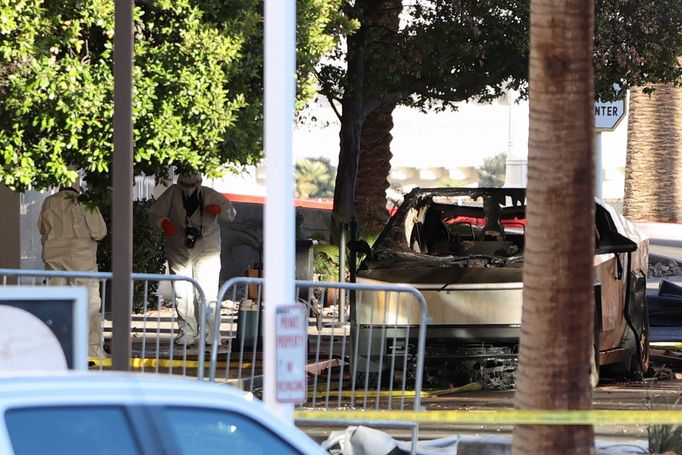 The remains of a Tesla Cybertruck that burned at the entrance of Trump Tower, stand inside a cordoned area, in Las Vegas, Nevada, U.S. January 1, 2025.  REUTERS/Ronda Chu