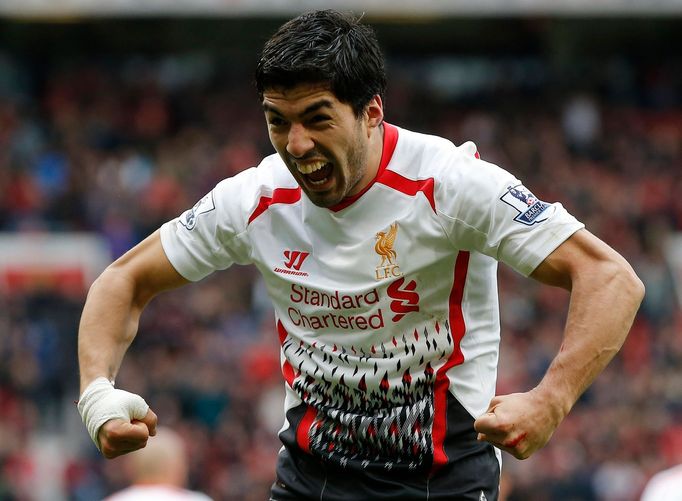 Liverpool's Suarez celebrates after scoring his side's third goal during their English Premier League soccer match against Manchester United at Old Trafford in Manchester