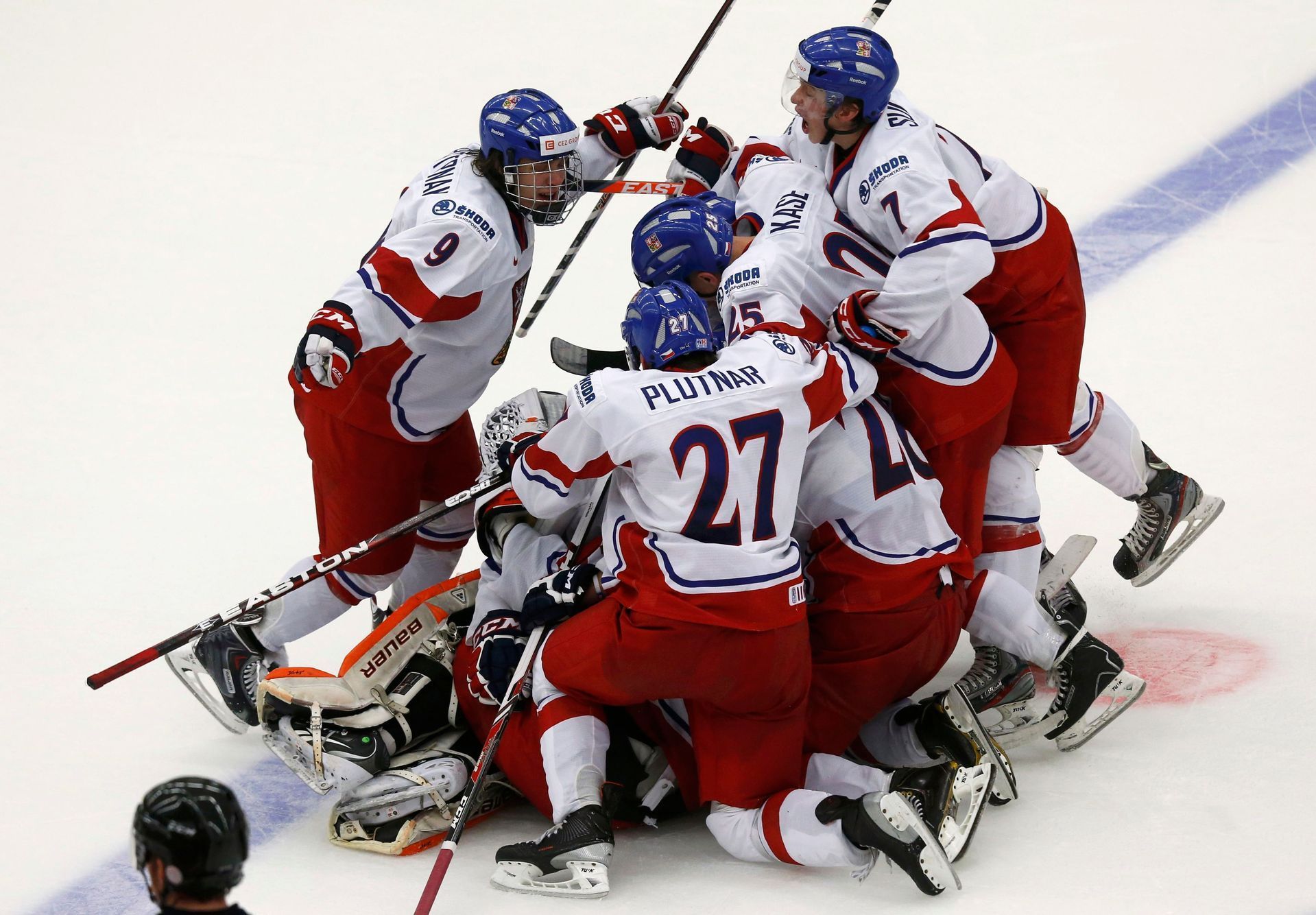 Members of the Czech Republic's team celebrate after defeating Canada in a shootout of their IIHF World Junior Championship ice hockey game in Malmo