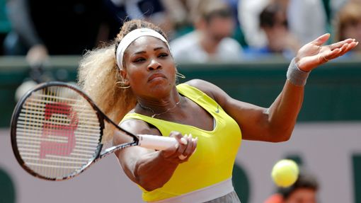 Serena Williams of the U.S. returns a forehand to Garbine Muguruza of Spain during their women's singles match at the French Open tennis tournament at the Roland Garros s