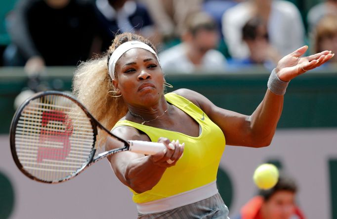 Serena Williams of the U.S. returns a forehand to Garbine Muguruza of Spain during their women's singles match at the French Open tennis tournament at the Roland Garros s