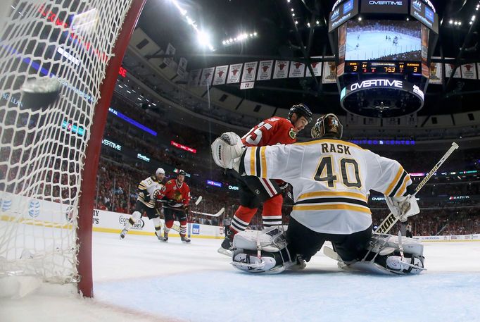 Chicago Blackhawks center Andrew Shaw scores the game-winning goal in triple-overtime past Boston Bruins goalie Tuukka Rask (40) during Game 1 of their NHL Stanley Cup Fi