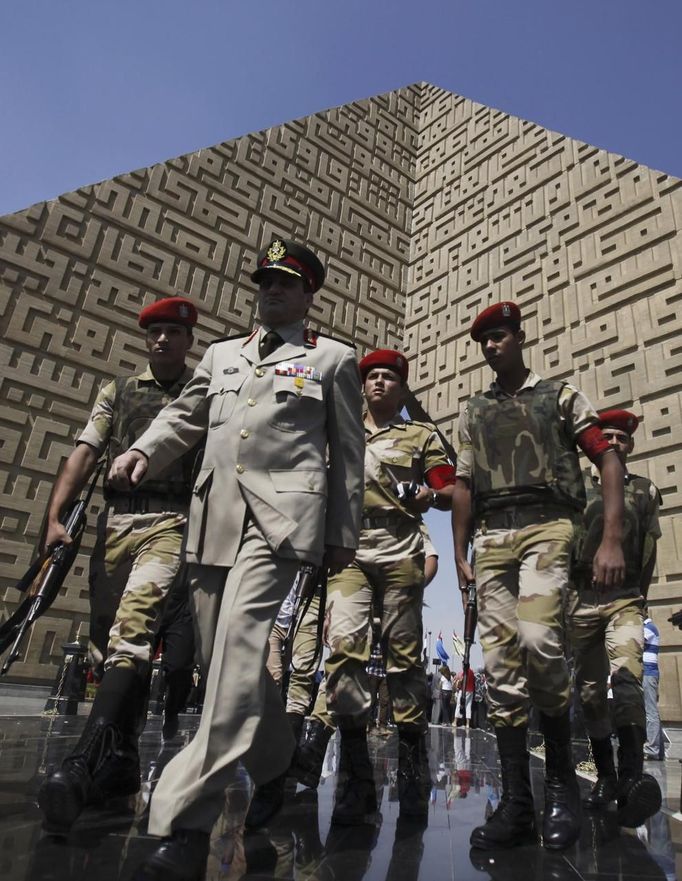 Members of the army walk at the tomb of late President Anwar Sadat during the 40th anniversary of Egypt's attack on Israeli forces in the 1973 war, at Cairo's Nasr City district, October 6, 2013.