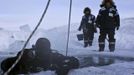 Alexander Gubin, 43, prepares to dive into the frozen Labynkyr lake, some 100 km south from Oymyakon in the Republic of Sakha, northeast Russia, February 1, 2013. The coldest temperatures in the northern hemisphere have been recorded in Sakha, the location of the Oymyakon valley, where according to the United Kingdom Met Office a temperature of -67.8 degrees Celsius (-90 degrees Fahrenheit) was registered in 1933 - the coldest on record in the northern hemisphere since the beginning of the 20th century. Yet despite the harsh climate, people live in the valley, and the area is equipped with schools, a post office, a bank, and even an airport runway (albeit open only in the summer). Picture taken February 1, 2013. REUTERS/Maxim Shemetov (RUSSIA - Tags: SOCIETY TPX IMAGES OF THE DAY ENVIRONMENT) ATTENTION EDITORS: PICTURE 19 OF 27 FOR PACKAGE 'THE POLE OF COLD' SEARCH 'MAXIM COLD' FOR ALL IMAGES Published: Úno. 18, 2013, 11:26 dop.