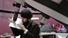 Astronomer Raminder Samra attempts to get the view of Venus crossing the Sun using a shadow on a piece of paper and the telescope at the MacMillan Southam Observatory in Vancouver, British Columbia June 5, 2012. Unfortunately, cloud cover prevented a proper view of celestial event. REUTERS/Andy Clark (CANADA - Tags: ENVIRONMENT SOCIETY SCIENCE TECHNOLOGY) Published: Čer. 5, 2012, 11:13 odp.