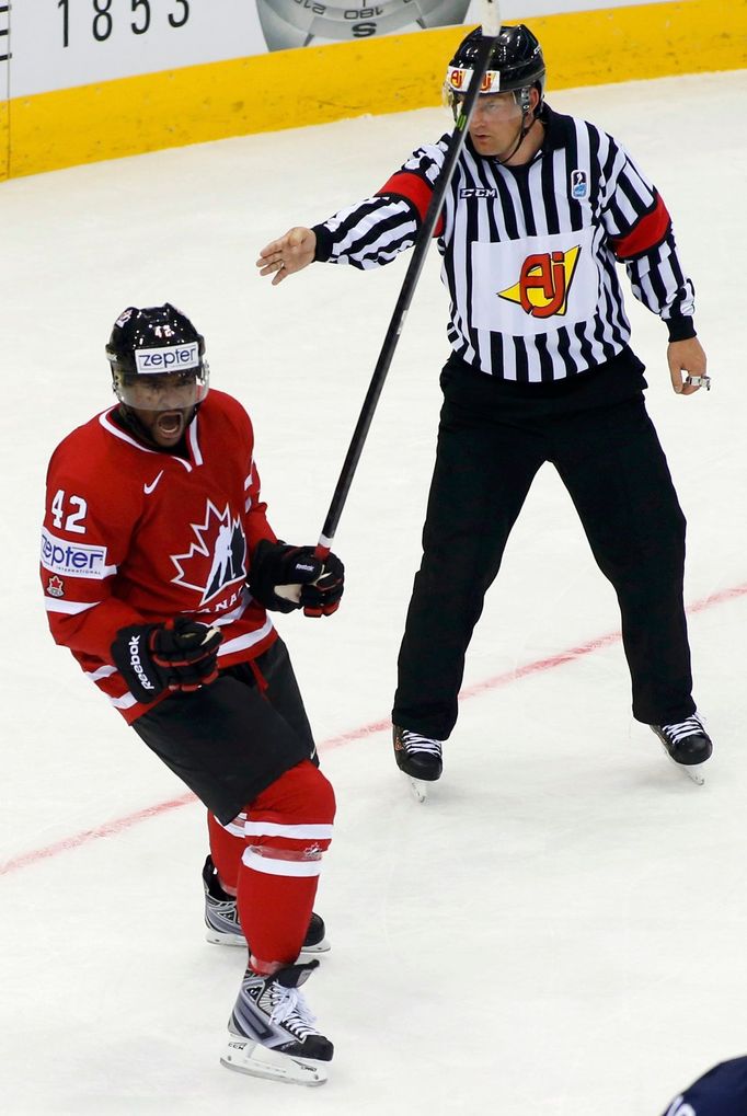 Canada's Joel Ward (L) celebrates his goal against Slovakia during the second period of their men's ice hockey World Championship group A game at Chizhovka Arena in Minsk