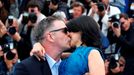 Alec Baldwin (L) kisses his wife Hilaria Thomas