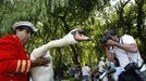 The Queen's Swan Marker David Barber is photographed as he lifts a swan during the annual Swan Upping ceremony on the River Thames between Shepperton and Windsor in sout