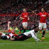 Manchester United's Vidic fouls Liverpool's Sturridge to concede a penalty and be sent off during their English Premier League soccer match at Old Trafford in Manchester
