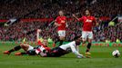 Manchester United's Vidic fouls Liverpool's Sturridge to concede a penalty and be sent off during their English Premier League soccer match at Old Trafford in Manchester