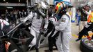 Actor Patrick Dempsey (L) changes his seat with Joe Foster of the U.S. during the Le Mans 24-hour sportscar race in central France June 22, 2013. Dempsey competed with hi