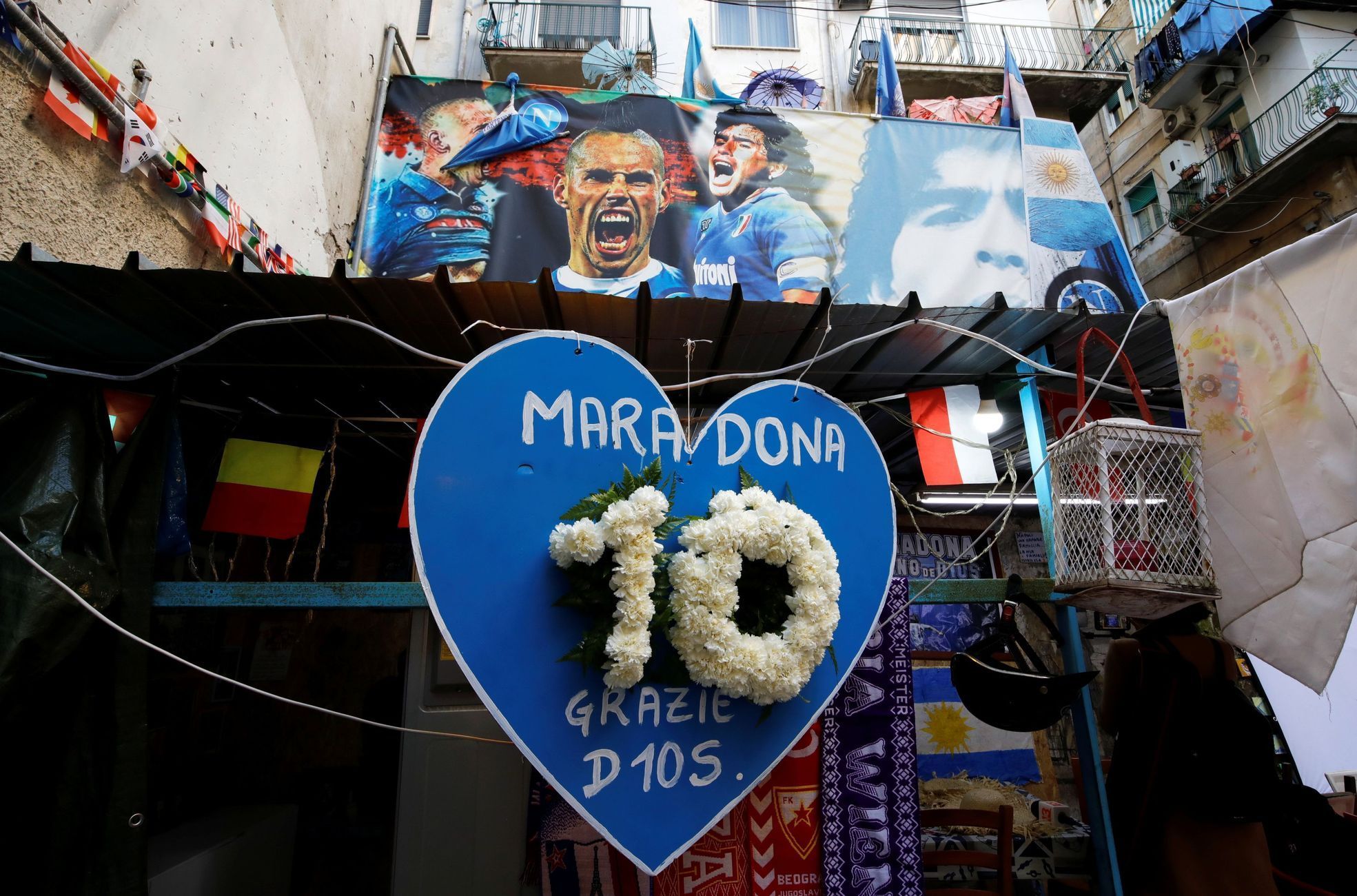 People gather to mourn the death of Argentine soccer legend Diego Maradona in Naples