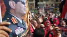 People chant pro-military slogans in Tahrir square as they celebrate the anniversary of an attack on Israeli forces during the 1973 war, in Cairo