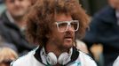 Stefan Kendal Gordy, known as Redfoo, of the band LMFAO, watches his girlfriend Victoria Azarenka of Belarus after she defeated Maria Joao Koehler of Portugal in their wo