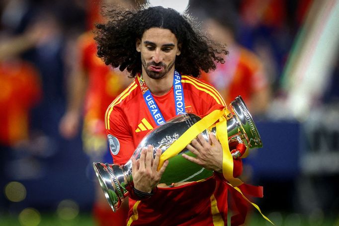 Soccer Football - Euro 2024 - Final - Spain v England - Berlin Olympiastadion, Berlin, Germany - July 14, 2024 Spain's Marc Cucurella celebrates with the trophy after win