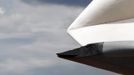 The damaged starboard wing of the Space Shuttle Enterprise is seen as it is lifted onto the deck of the Intrepid Sea, Air and Space Museum in New York June 6, 2012. The shuttle suffered minor wingtip damage when it grazed a bridge's protective piling while being transported from JFK airport to a marina in New Jersey on Sunday, according to a spokesman for the Intrepid Museum. REUTERS/Eric Thayer (UNITED STATES - Tags: SCIENCE TECHNOLOGY TRANSPORT) Published: Čer. 6, 2012, 10:57 odp.