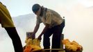 Sulfur Miners Of Ijen Crater Indonesia BANYUWANGI, INDONESIA - UNDATED: Miners lift sulfur at a mine in the crater of Ijen, Banyuwangi, Indonesia. Sulphur miners at the I