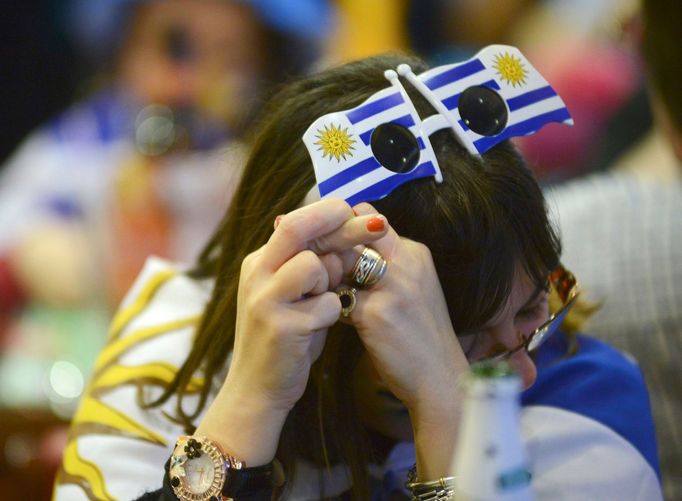 A Uruguayan soccer fan reacts during an open air broadcast of the 2014 World Cup Group D soccer match between Costa Rica and Uruguay, in Montevideo June 14, 2014. REUTERS