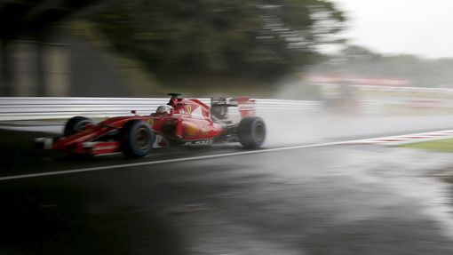 Ferrari Formula One driver Sebastian Vettel of Germany drives during the second practice session in Suzuka, Japan, September 25, 2015, ahead of Sunday's Japanese F1 Grand