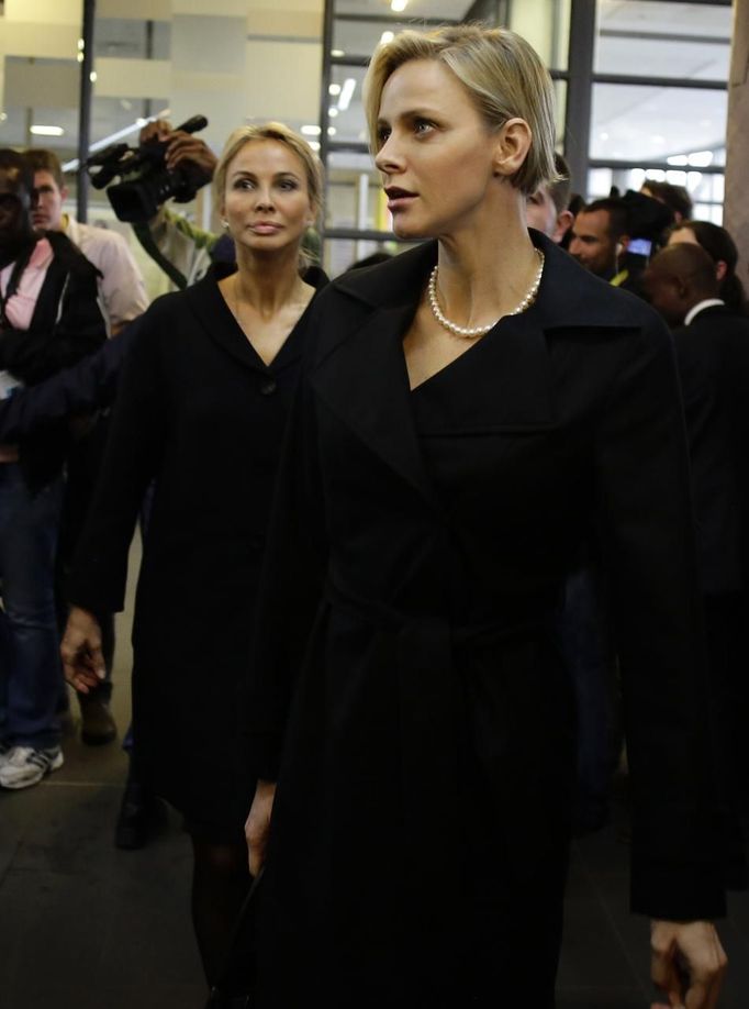 Princess Charlene of Monaco (R) arrives for the service for former South African President Nelson Mandela at the First National Bank Stadium, also known as Soccer City, in Johannesburg December 10, 2013.