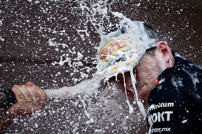 Formula One F1 - Monaco Grand Prix - Circuit de Monaco, Monte Carlo, Monaco - May 28, 2023 Red Bull's Max Verstappen celebrates with champange on the podium after winning