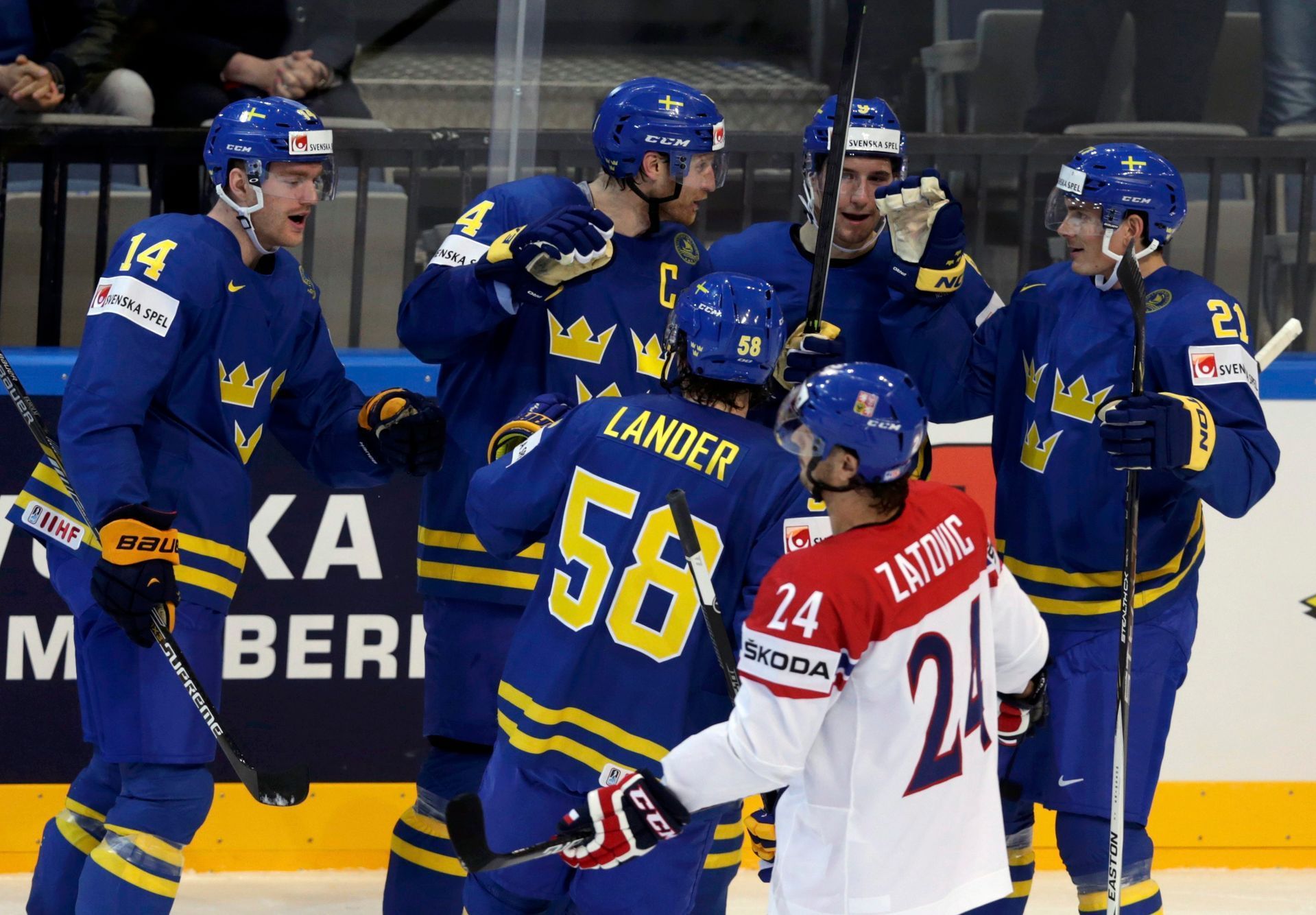 Sweden's Kronwall celebrates with team mates his goal against the Czech Republic during their Ice Hockey World Championship game at O2 arena in Prague
