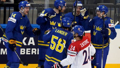 Sweden's Kronwall celebrates with team mates his goal against the Czech Republic during their Ice Hockey World Championship game at O2 arena in Prague
