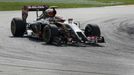 Lotus Formula One driver Pastor Maldonado of Venezuela takes a corner during the Malaysian F1 Grand Prix at Sepang International Circuit outside Kuala Lumpur, March 30, 2