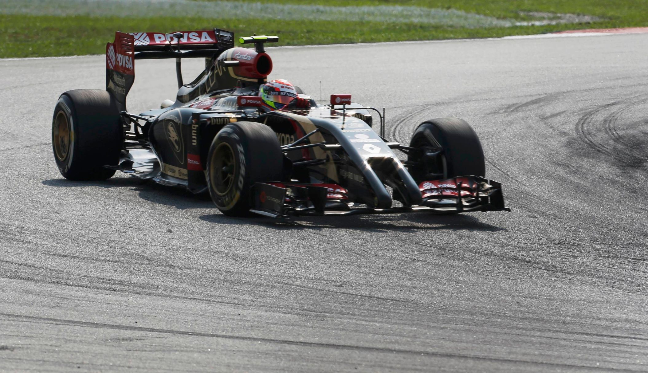Lotus Formula One driver Maldonado of Venezuela takes a corner during the Malaysian F1 Grand Prix at Sepang International Circuit outside Kuala Lumpur