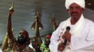 Supporters shout and gesture as Sudanese President Omar al-Bashir addresses a rally at the ruling National Congress Party (NCP) headquarters in Khartoum